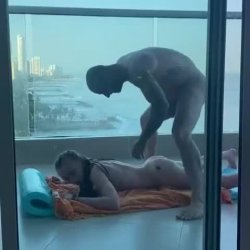 Your wife’s black personal trainer gives her pussy a workout on the balcony